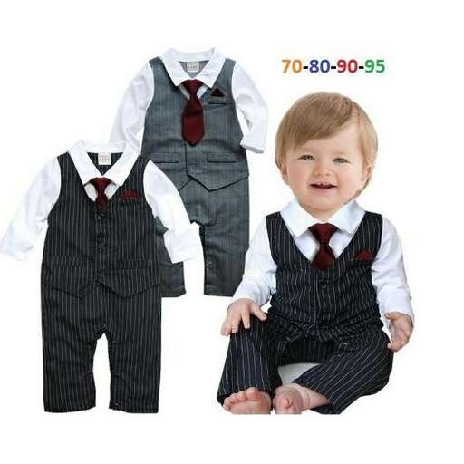 a baby boy wearing a suit and tie.