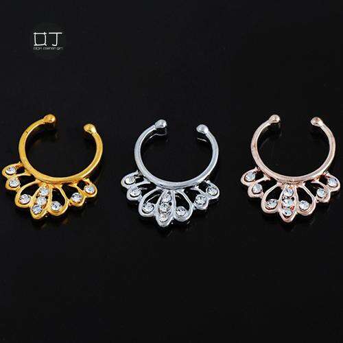 earrings in gold and silver with a white flower