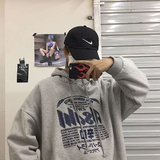person in the mirror with his hat