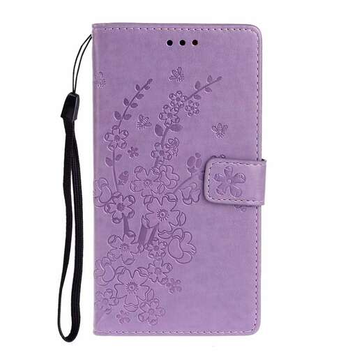 this is a small leather wallet with a flower design in the middle.