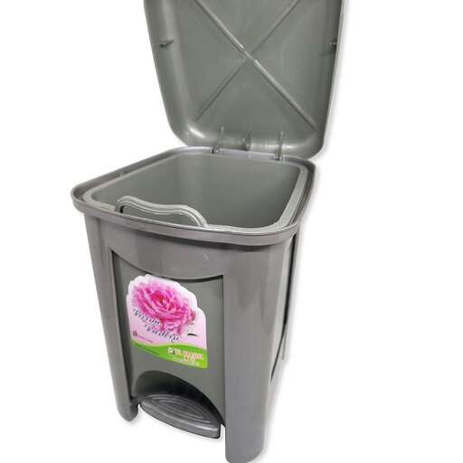 a plastic trash can with a flower on the lid.