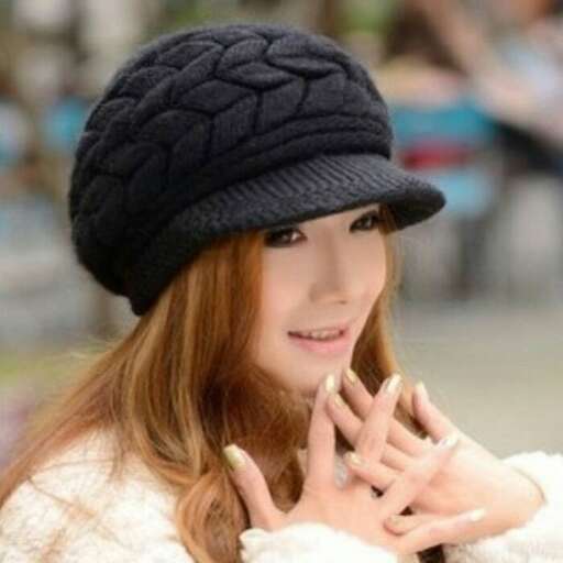 a girl in a black hat and a knitted hat