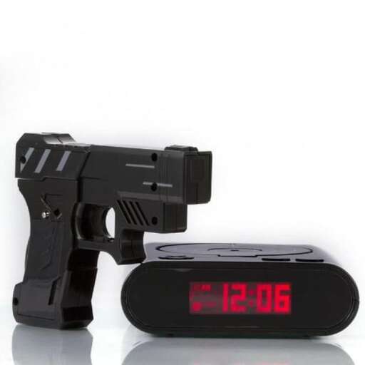 a black gun with a red clock next to it.