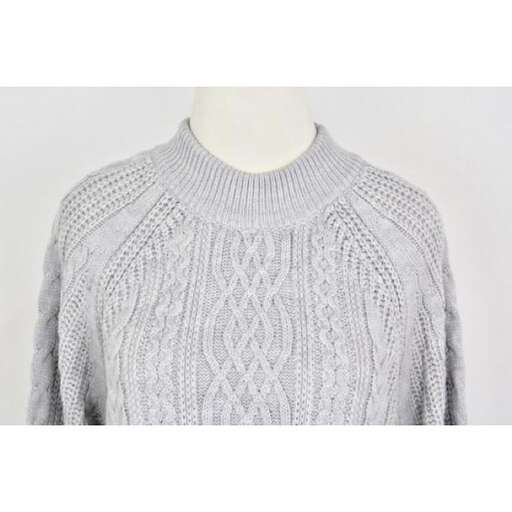 this sweater is made of wool and is available in sizes.
