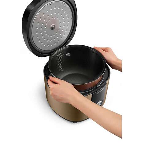 a person holding a pot with a lid