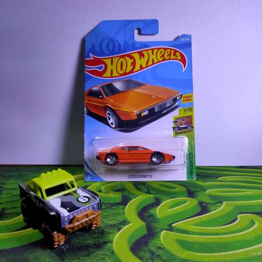 a toy car and a toy car in a box