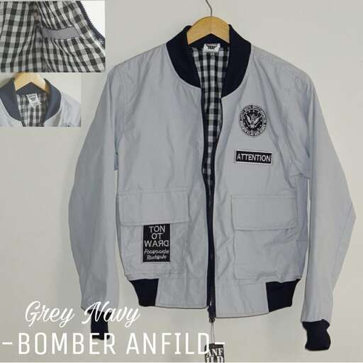 a jacket that is worn by a man.