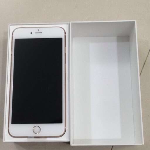 a white box with a black iphone inside of it.