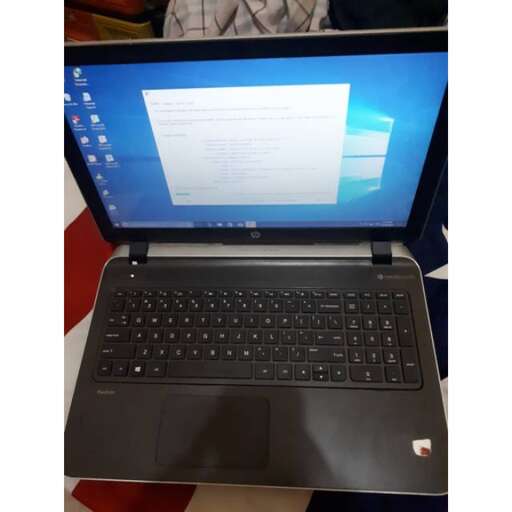 a laptop computer sitting on top of a table.