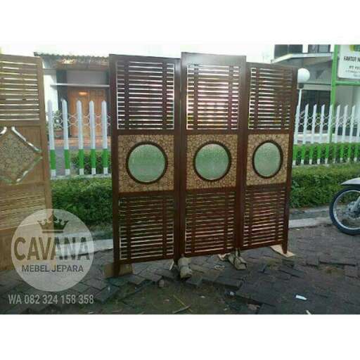 a wooden screen door with a wooden frame.