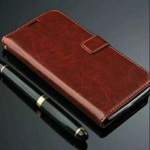 a brown leather wallet with a pen in it.