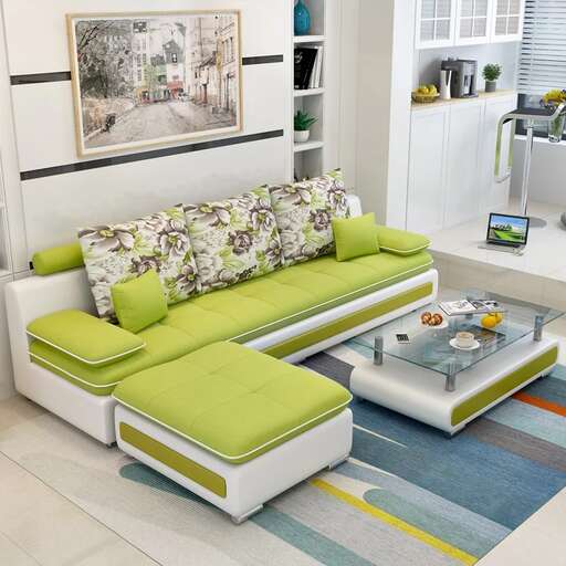 a living room with a green sofa and a coffee table.