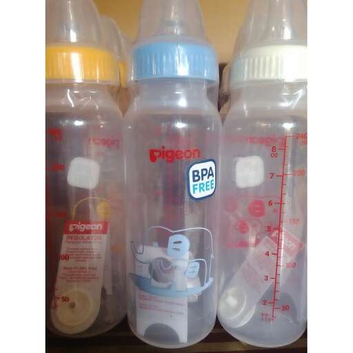 a group of bottles with a baby bottle in them.