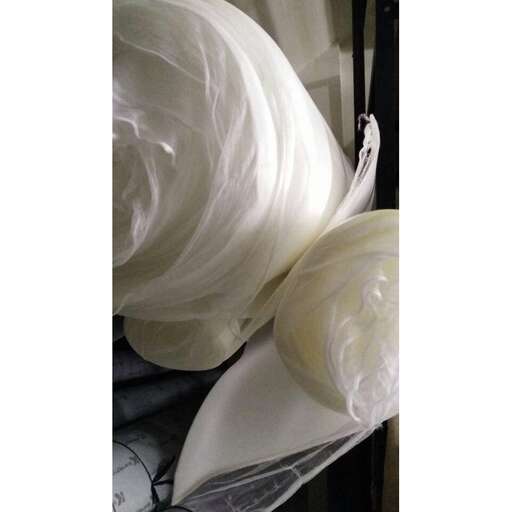 a white silk flower in a vase.