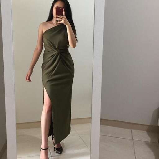 a model in a green dress