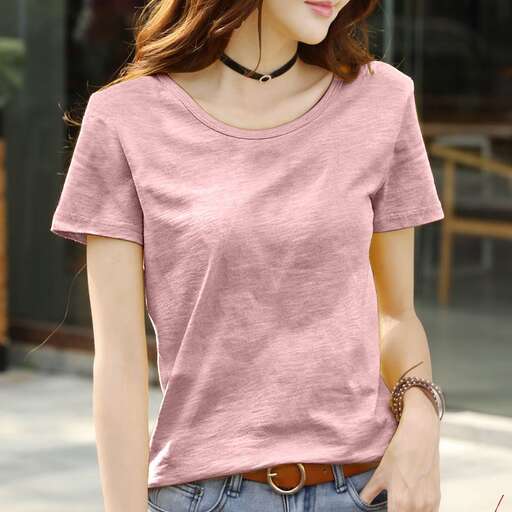 a cropped t - shirt is worn with a loose fitting t - shirt and a leather belt.