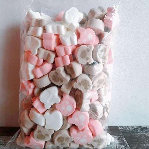 a large, pink, white and pink candy bag.