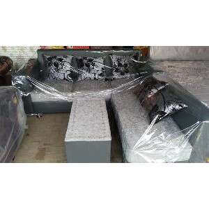 a concrete bench with a black and white flowered seat.