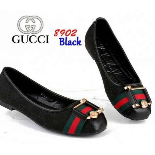 black leather high heeled shoes with a red and green stripe.