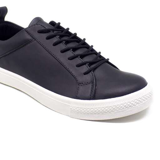 the shoe is a sneaker that is made of leather.