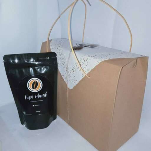 a black and white hair dryer and a white cloth.