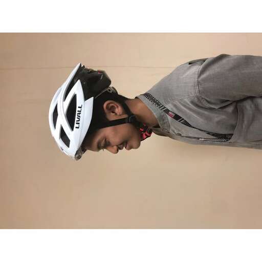 a young man wearing a helmet and a helmet.