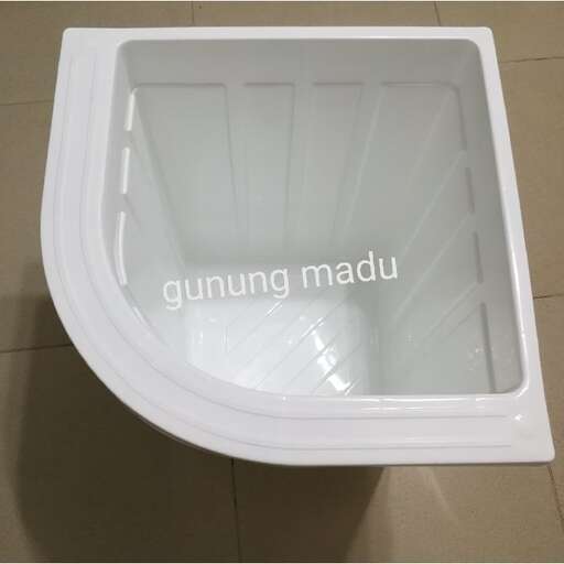 a white toilet with a glass door.