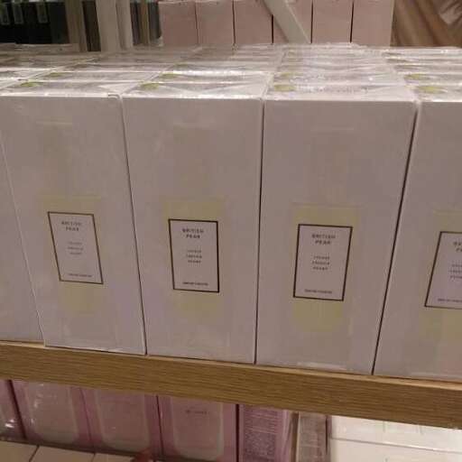 a table with many boxes of white and gold colored paper.