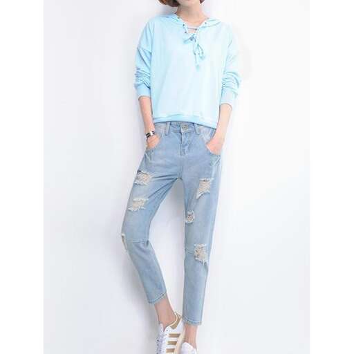 a light blue long sleeved top with a light blue top and white sneakers.