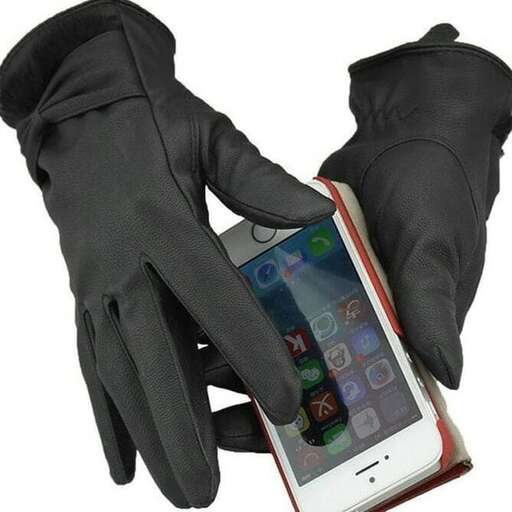 a pair of gloves that are being held up.