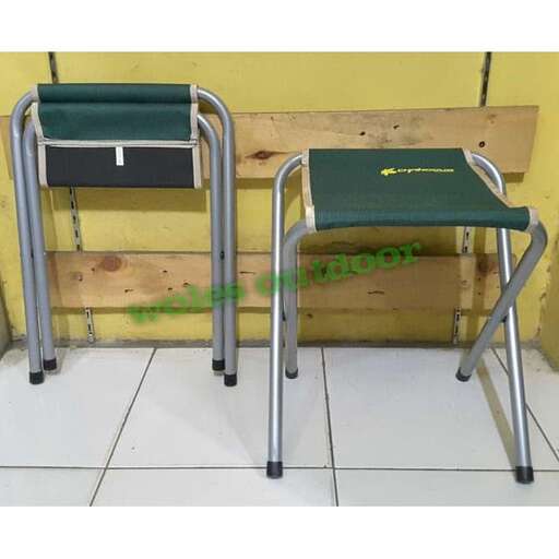 a pair of metal folding chairs sitting on top of a wooden bench.