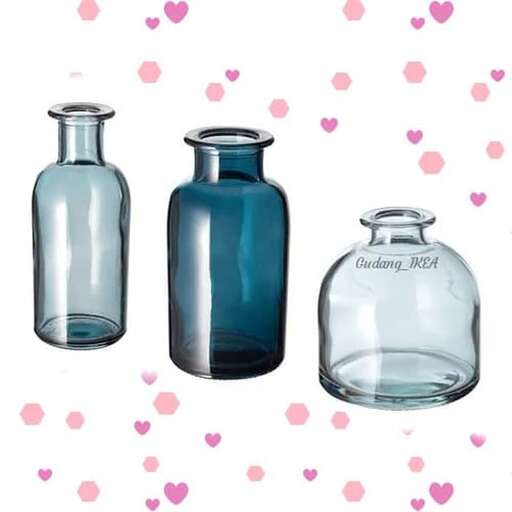 set of glass bottles with a heart on a white background