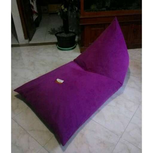 a purple cushion with a gold leaf on it.