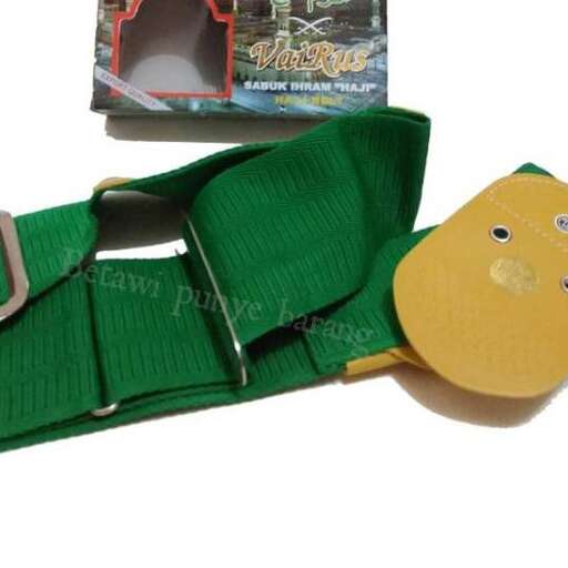 a green belt with a face on it.