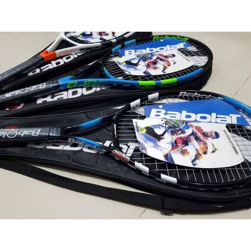 a pair of tennis rackets sitting on top of a table.