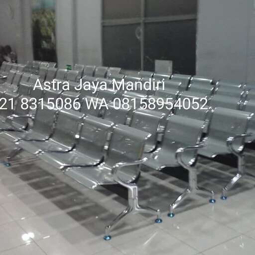 a row of empty chairs in a room.