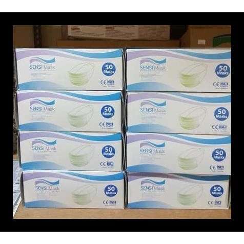a stack of boxes with a blue and white label