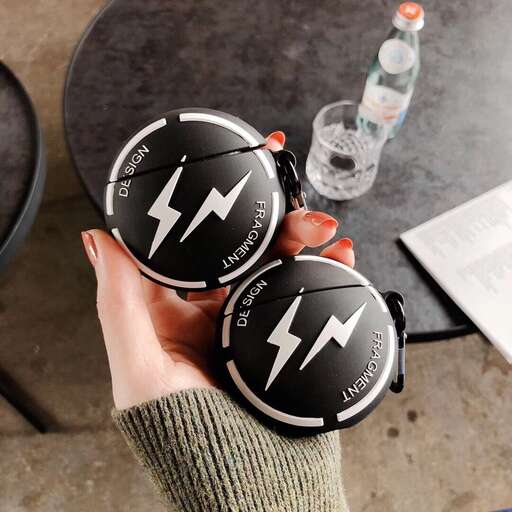 a hand holding a pair of plastic cups with a lightning bolt on it.