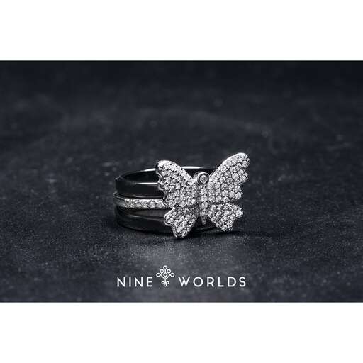 a ring with a butterfly on the ring.