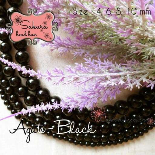 a close up of the flowers and beads.