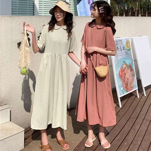 the dress is a long dress with a hat.