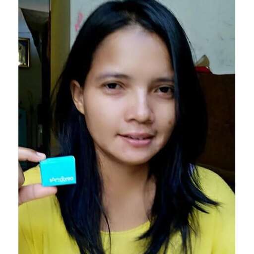 a girl with a blue card in her hand