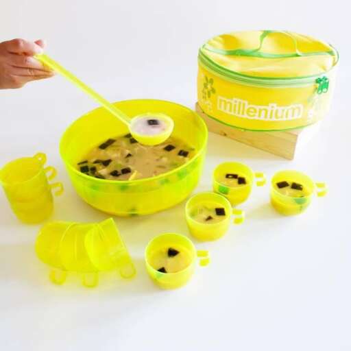 a yellow container with a lid and a yellow spoon.