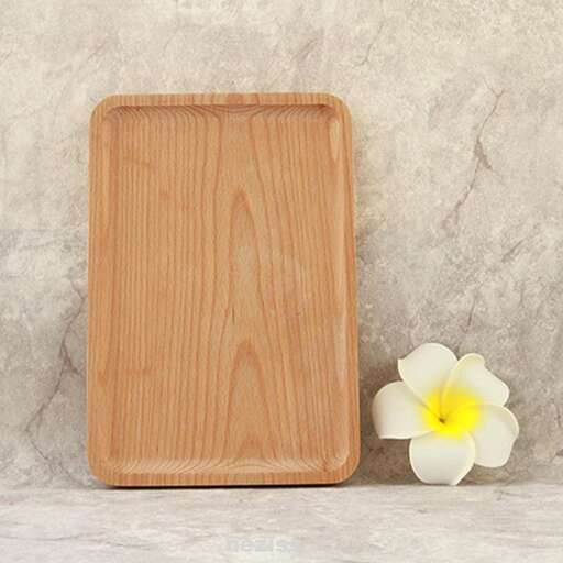 a wooden board with a flower on it.