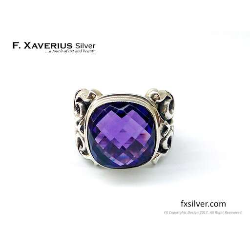 a ring with a purple sapphire.