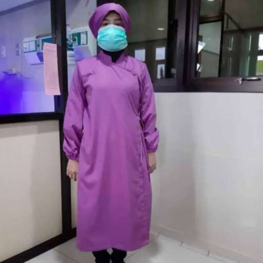 a person in a purple coat and a surgical mask.