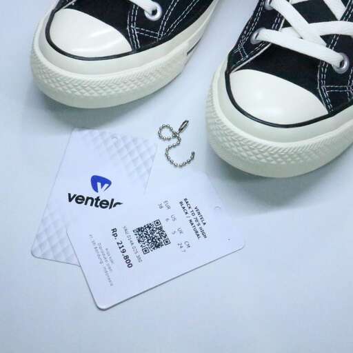 a pair of shoes with a logo on the front.
