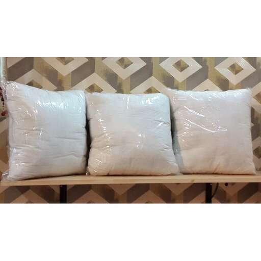 a couch with three pillows on it.