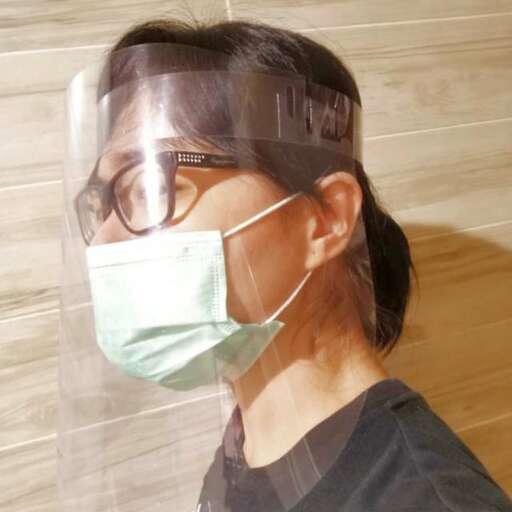 a woman wearing a surgical mask.