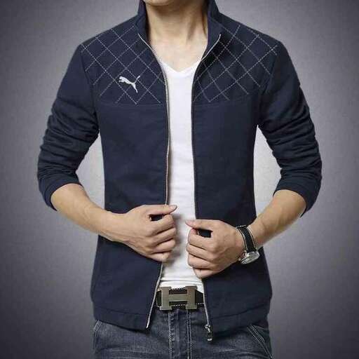 a man wearing a white shirt and jeans